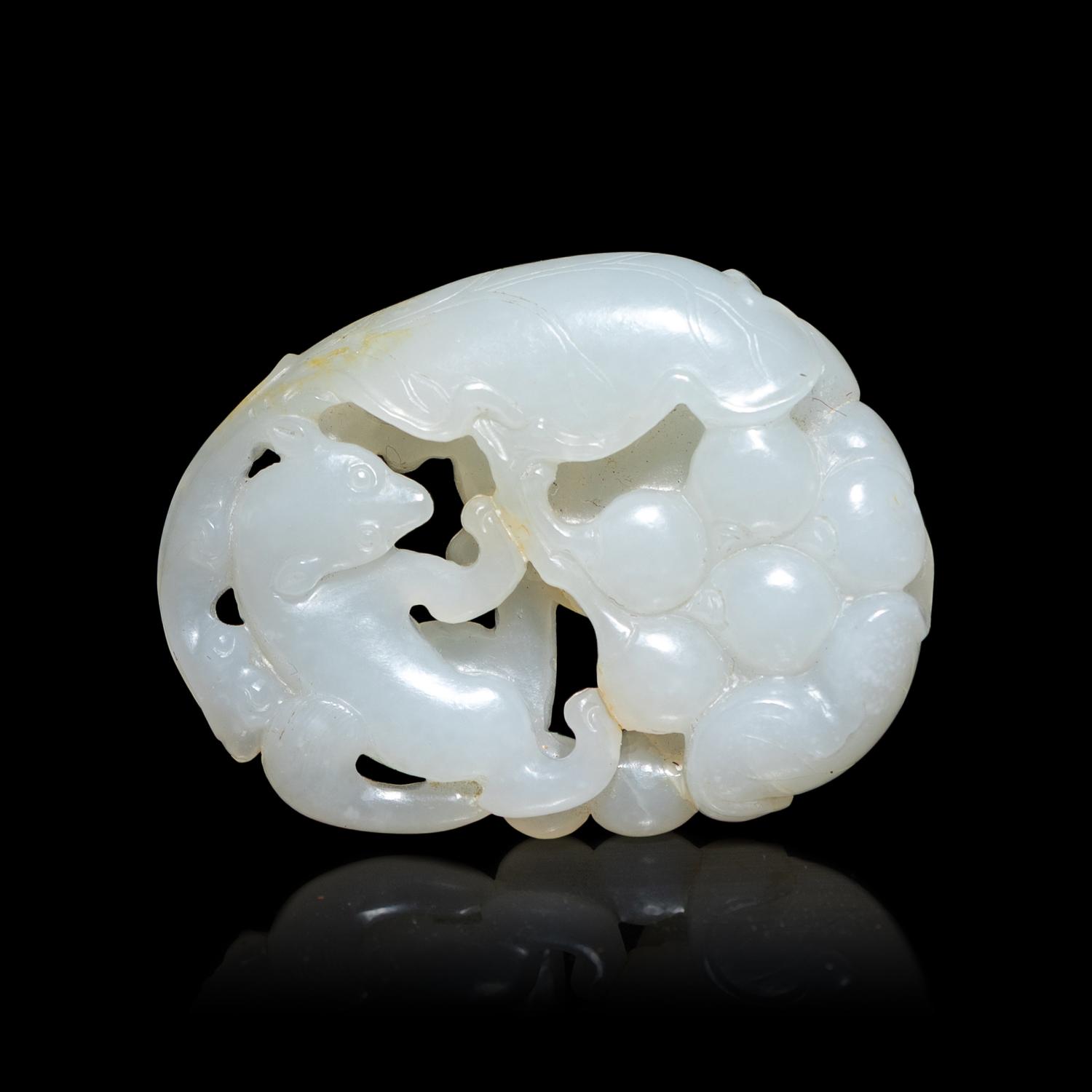 A Chinese White Jade 'Squirrel and Grape' Pendant, 20th Century 近代 白玉鏤雕松鼠葡萄紋珮