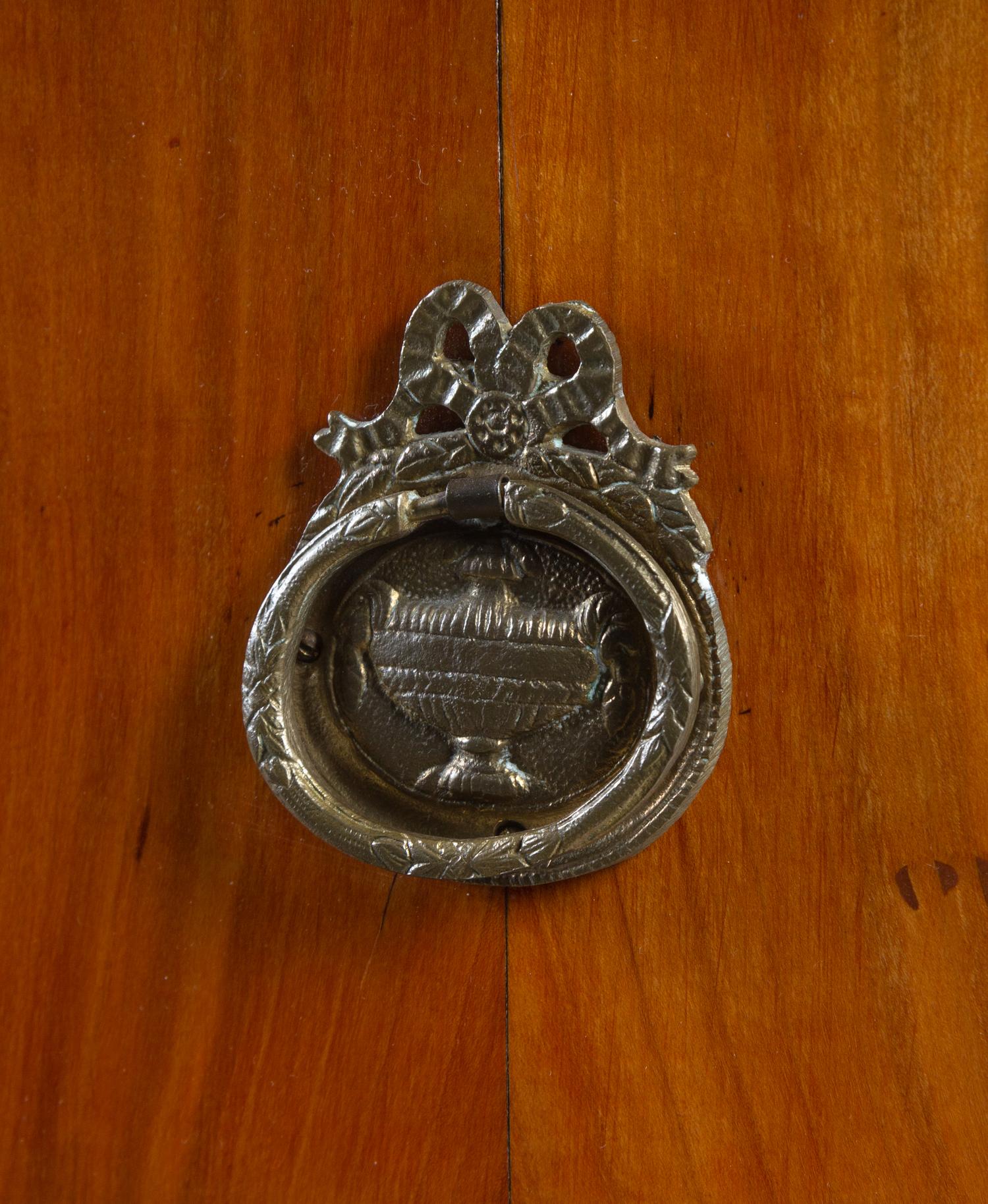 An Austrian Neoclassical Part-Ebonized Walnut Commode