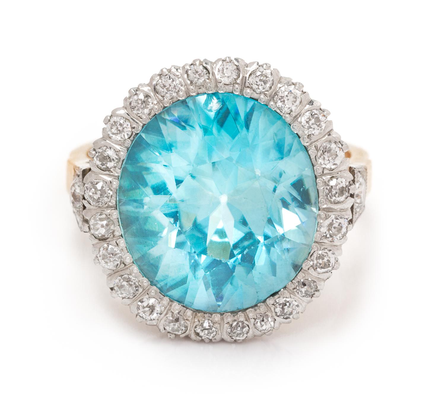 An Edwardian Platinum Topped Gold, Blue Zircon and Diamond Ring, 6.70 dwts.