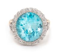 An Edwardian Platinum Topped Gold, Blue Zircon and Diamond Ring, 6.70 dwts.