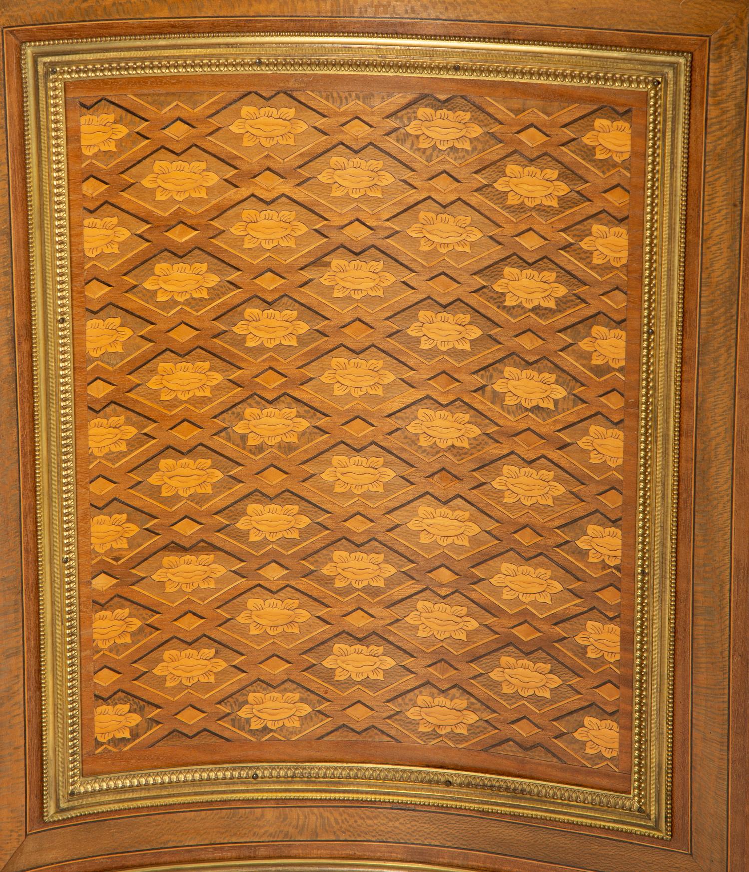 A Louis XVI Style Gilt Bronze Mounted Kingwood and Marquetry Marble-Top Commode