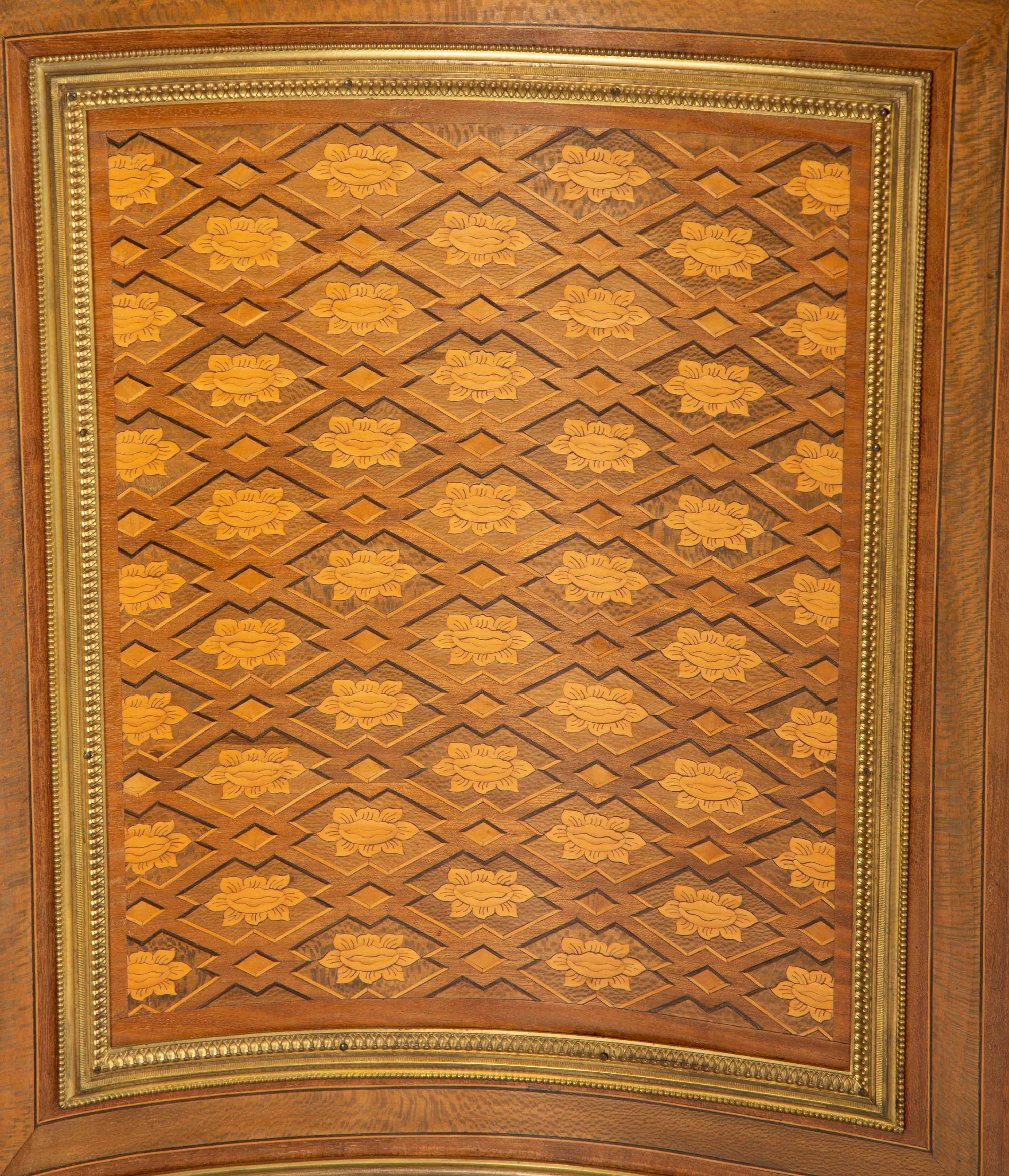 A Louis XVI Style Gilt Bronze Mounted Kingwood and Marquetry Marble-Top Commode