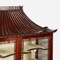 A pair of Chinese Chippendale style carved mahogany and glass display cabinets 20th century