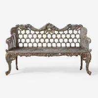 A white-painted cast iron garden bench late 19th century