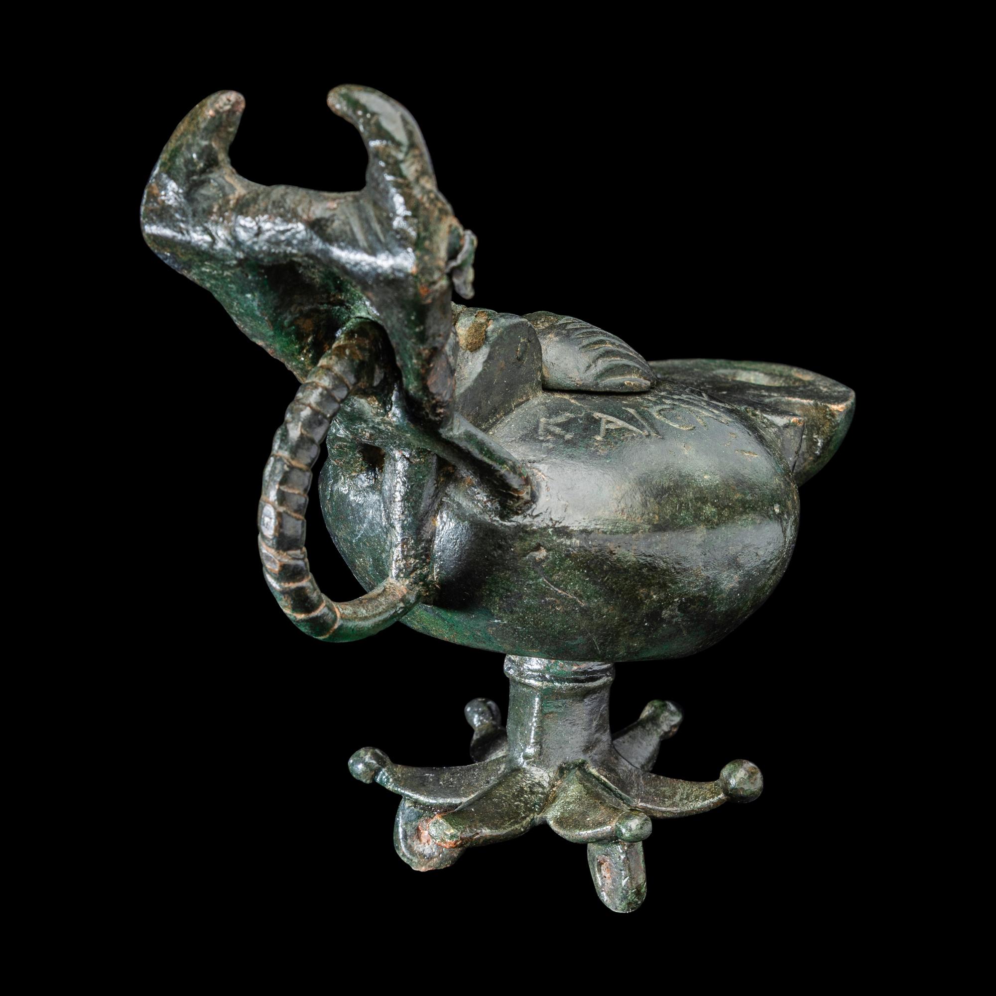 A Late Roman Bronze Lamp with Bull Head Handle and Greek Inscription