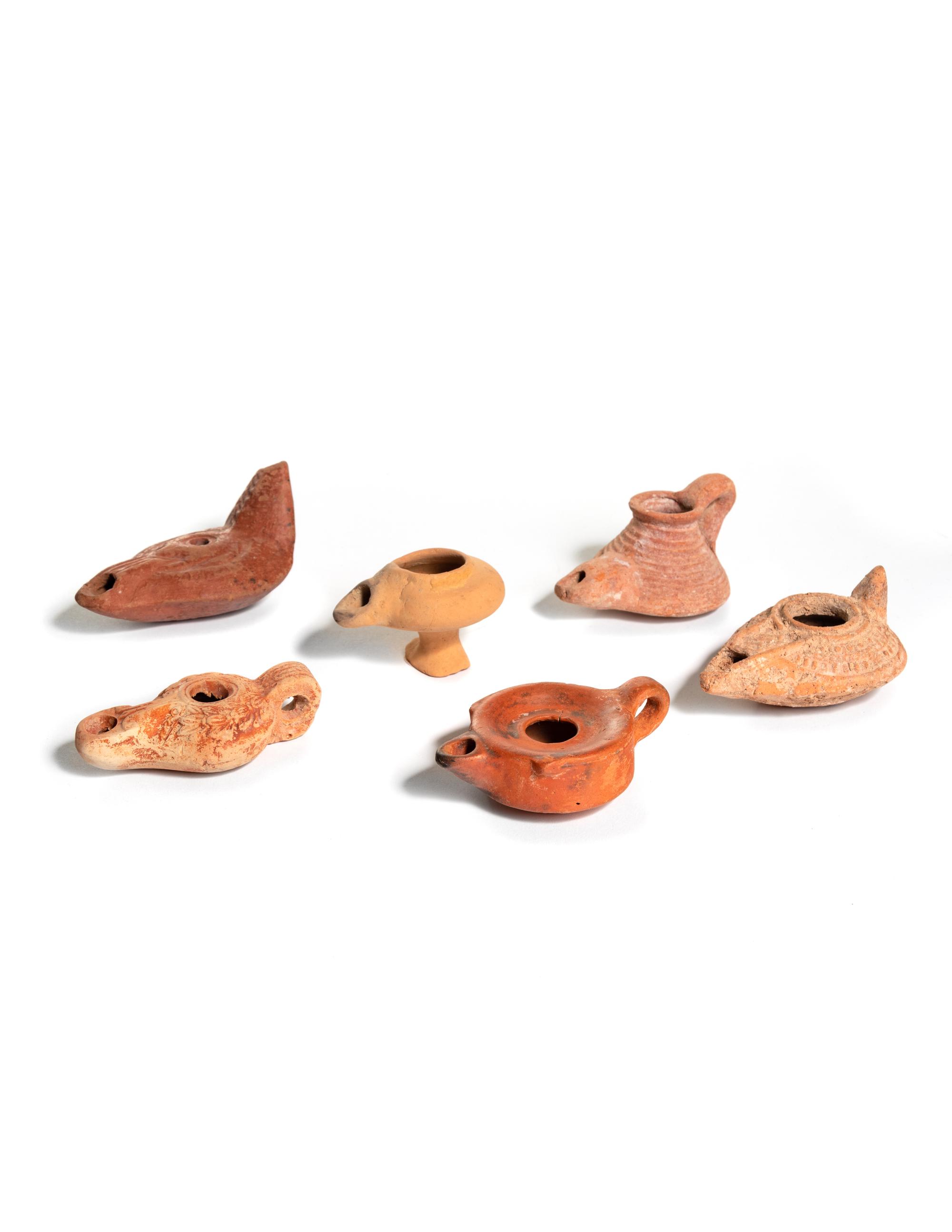 Six Roman Molded Terra Cotta Oil Lamps