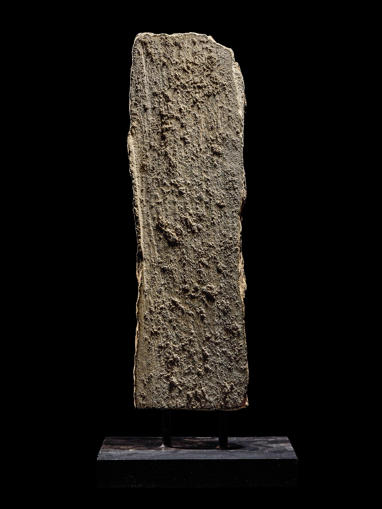 An Egyptian Limestone Relief Fragment with a Pharaoh