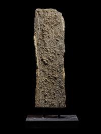 An Egyptian Limestone Relief Fragment with a Pharaoh