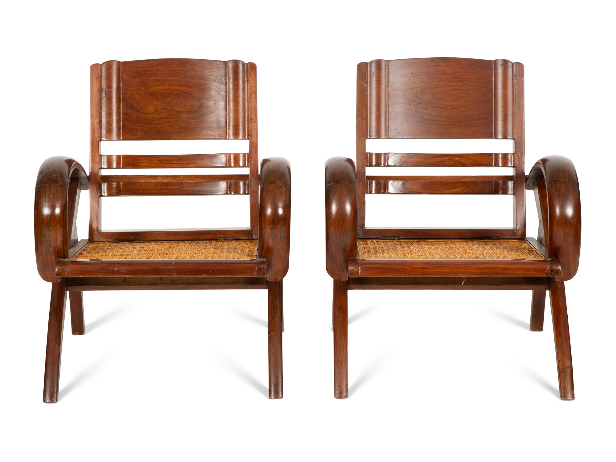 A Pair of Art Deco Walnut and Caned Folding Lounge Chairs