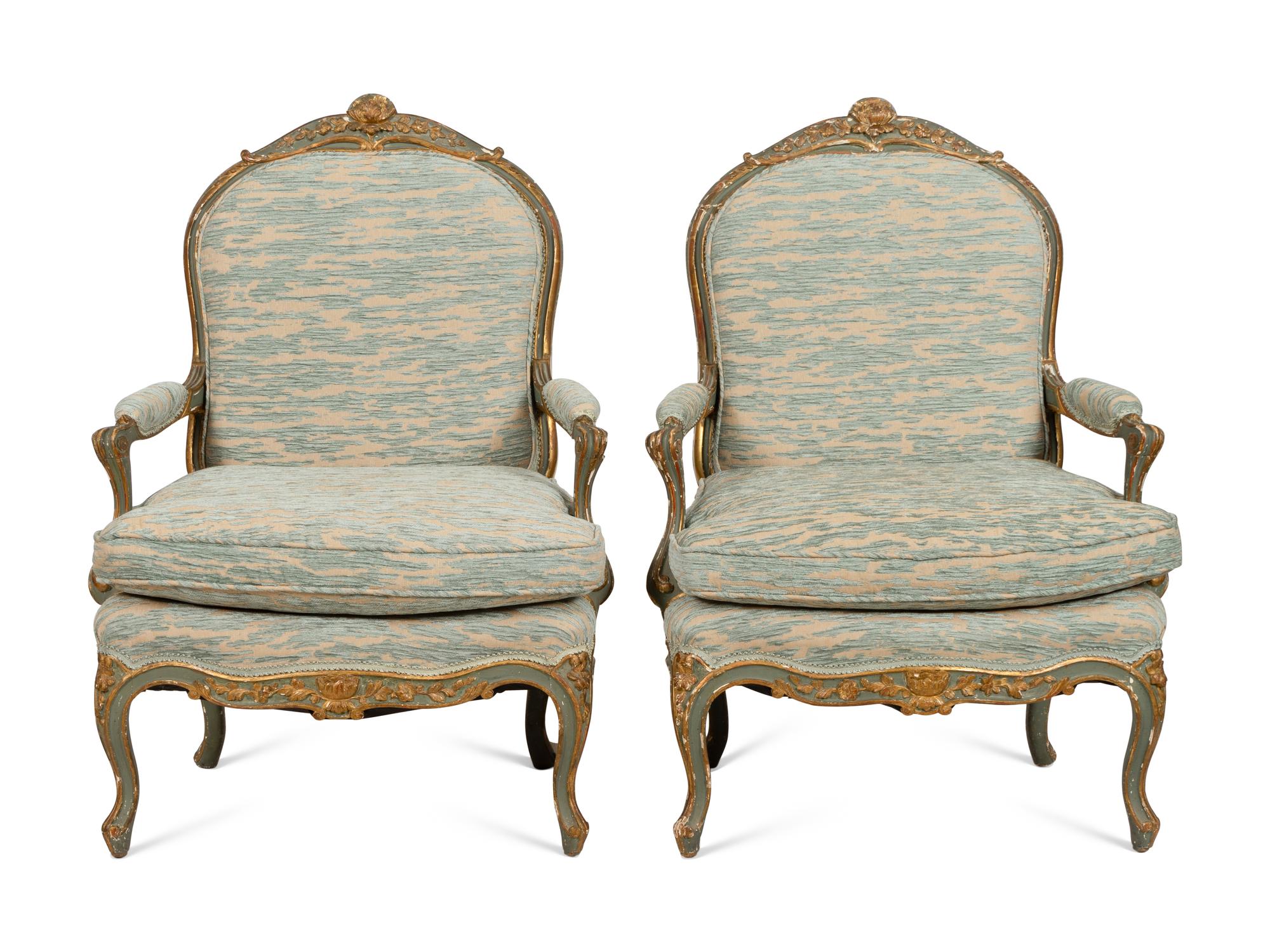 A Pair of Louis XV Style Green-Painted and Parcel Gilt Fauteuils