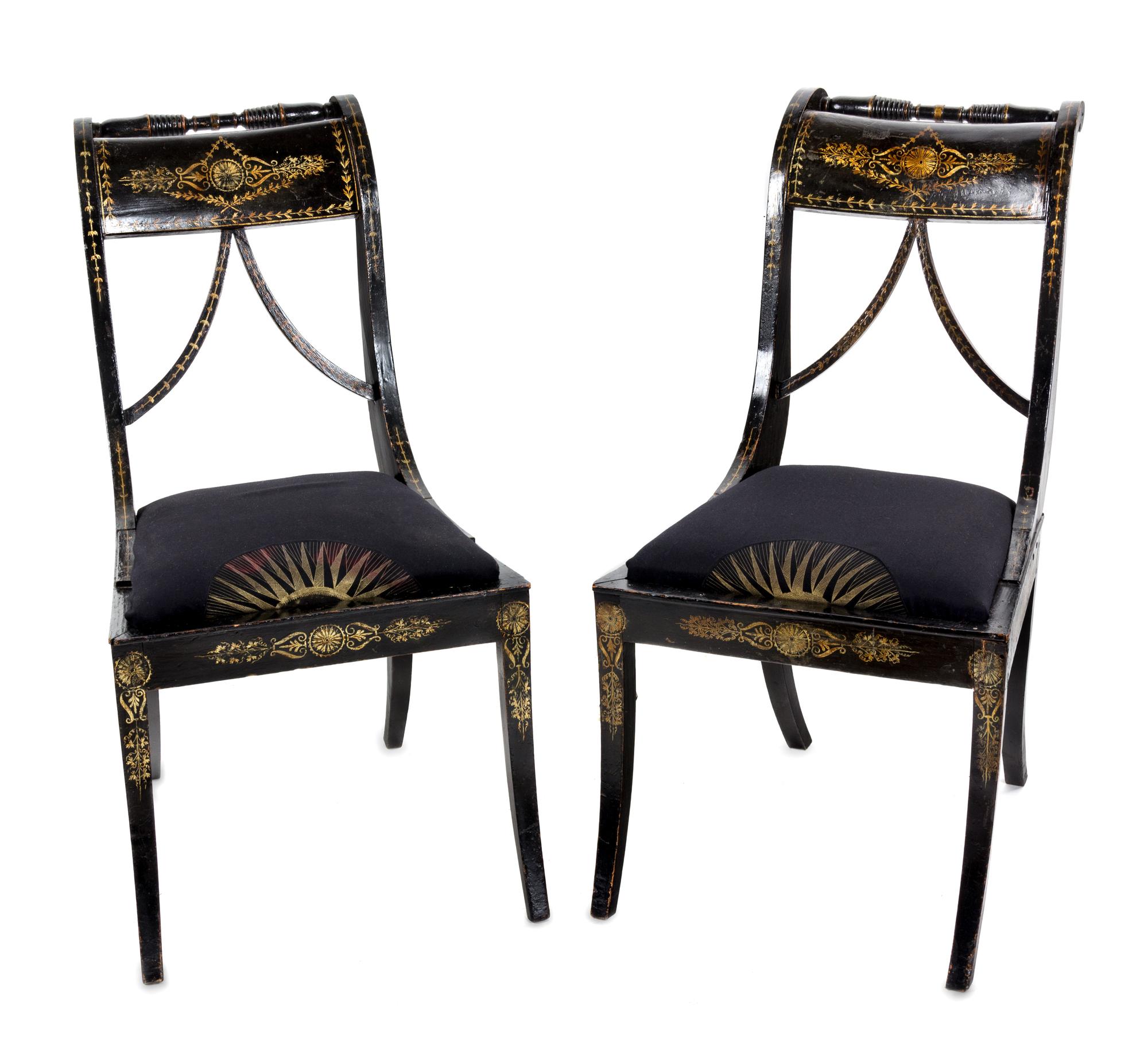 A Pair of Regency Ebonized and Parcel-Gilt Side Chairs Height 33 inches.