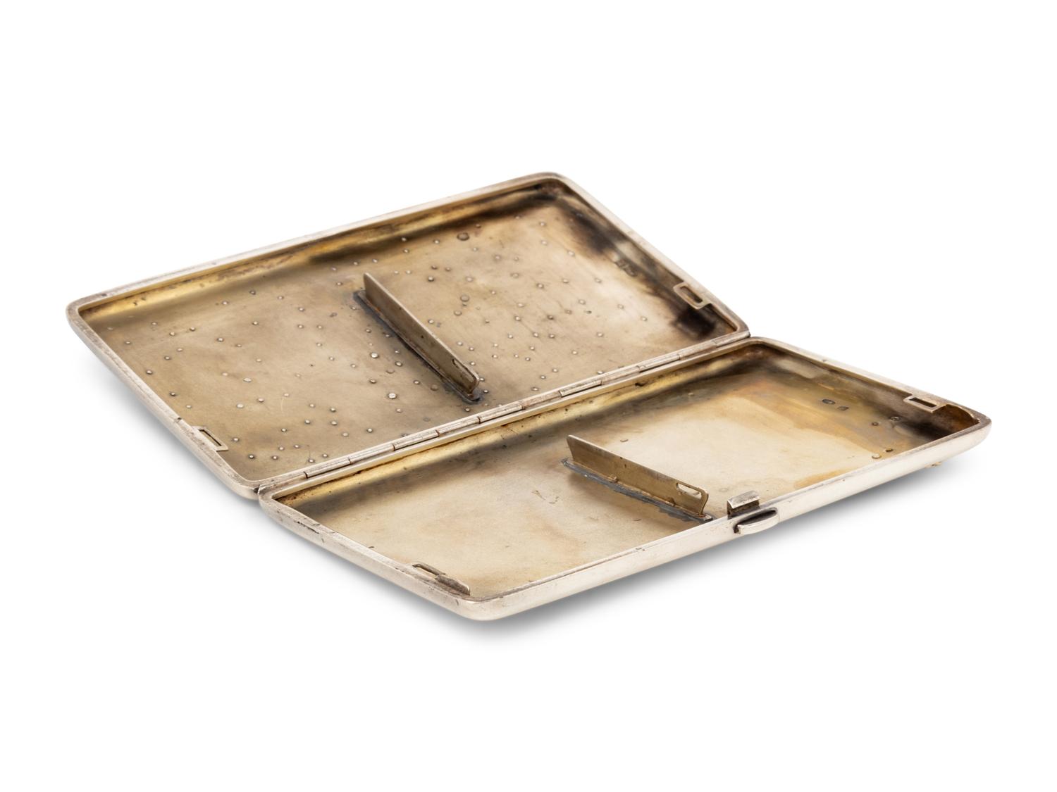 A Large Russian Silver and Gold-Charm Inset Cigarette Case