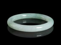 A Chinese Apple Green and Pale Celadon Jadeite Bangle