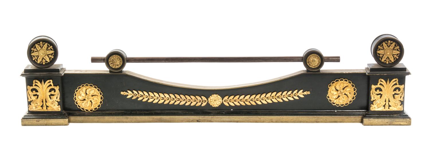 An Empire Gilt and Patinated Bronze Fire Guard, Width 39 inches.