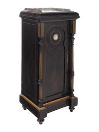 A Pair of English Aesthetic Jasperware Medallion-Mounted Ebonized and Parcel-Gilt Pedestal Cabinets