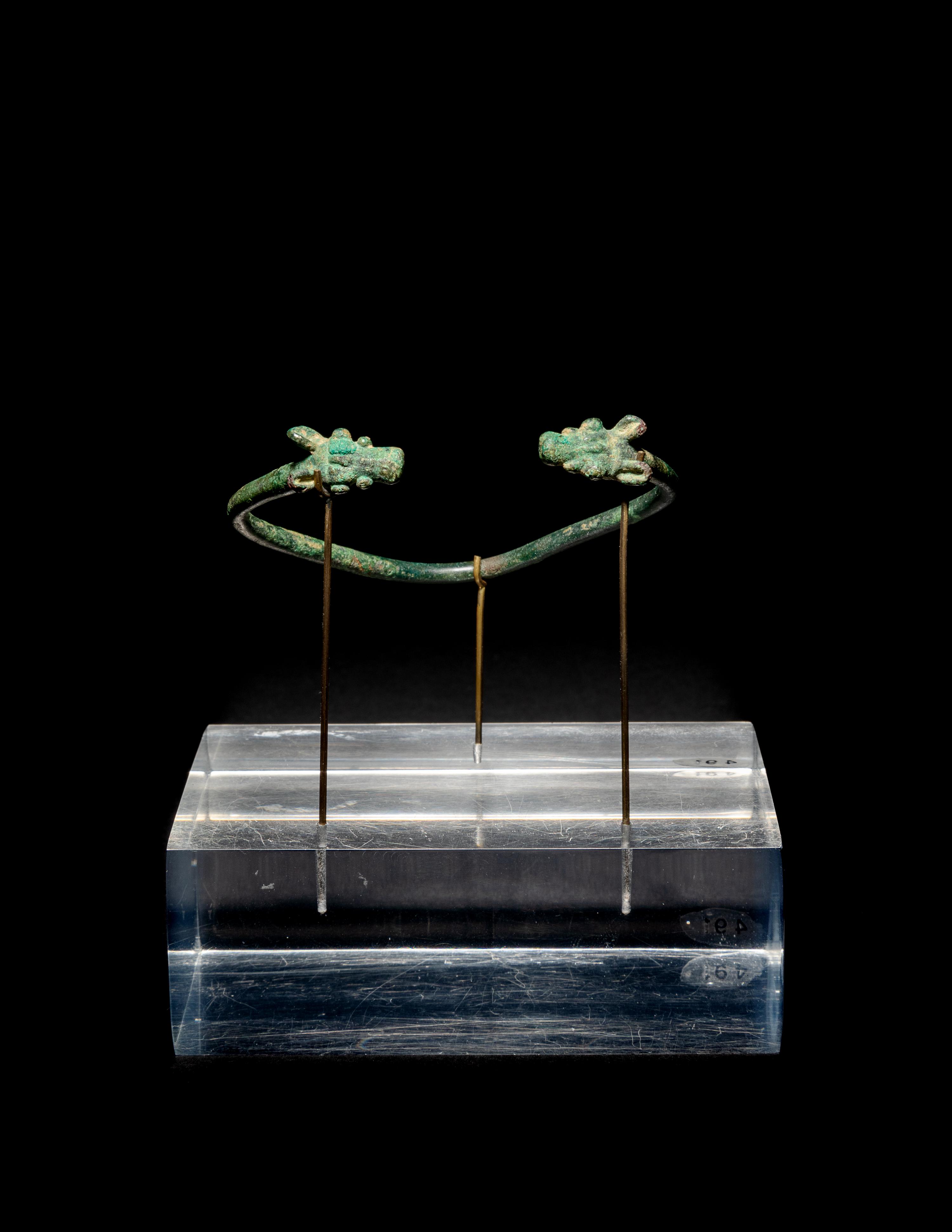 An Amlash or Luristan Bronze Bracelet with Animal Finials