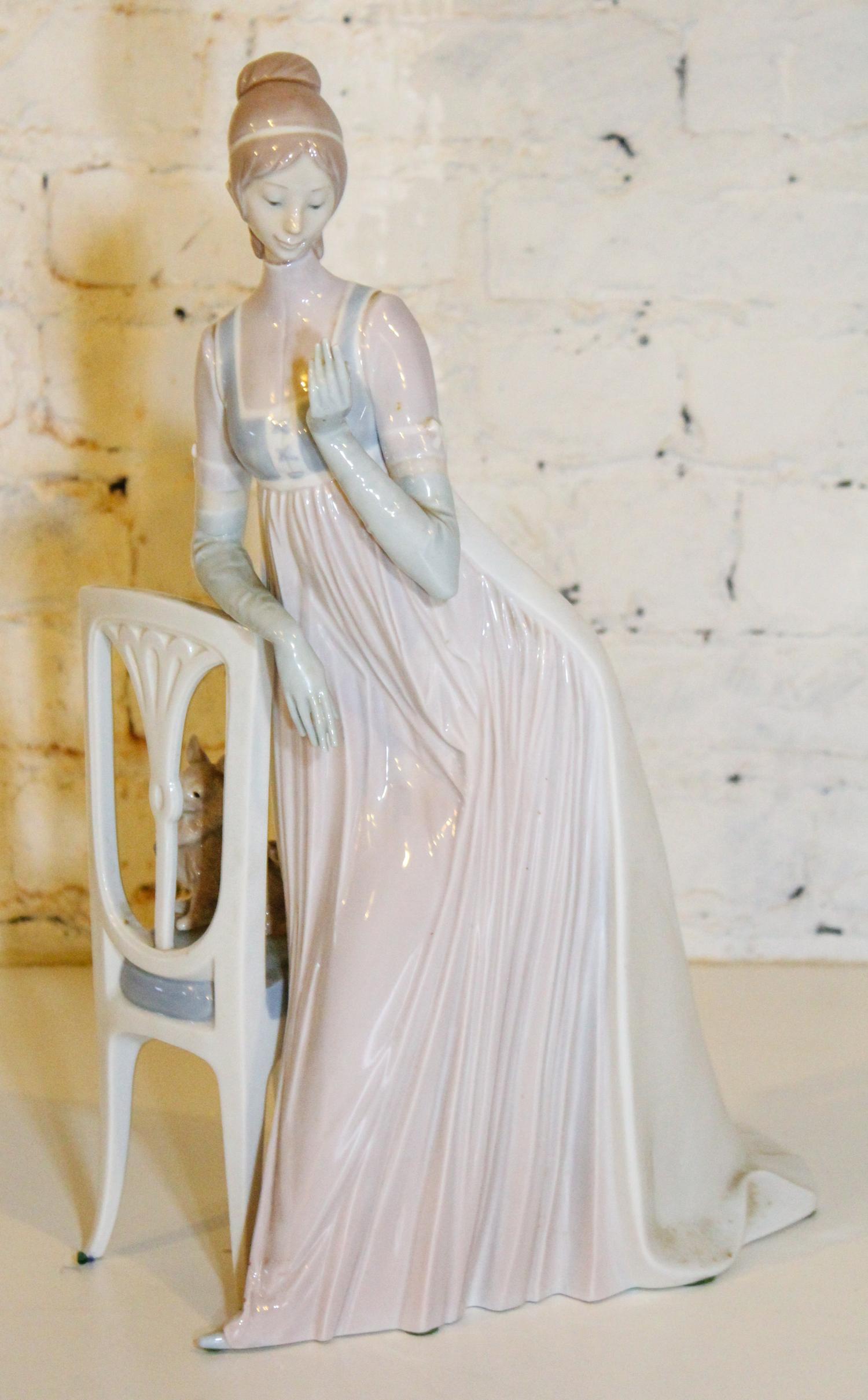 A Lladro Figure. Height 19 inches.