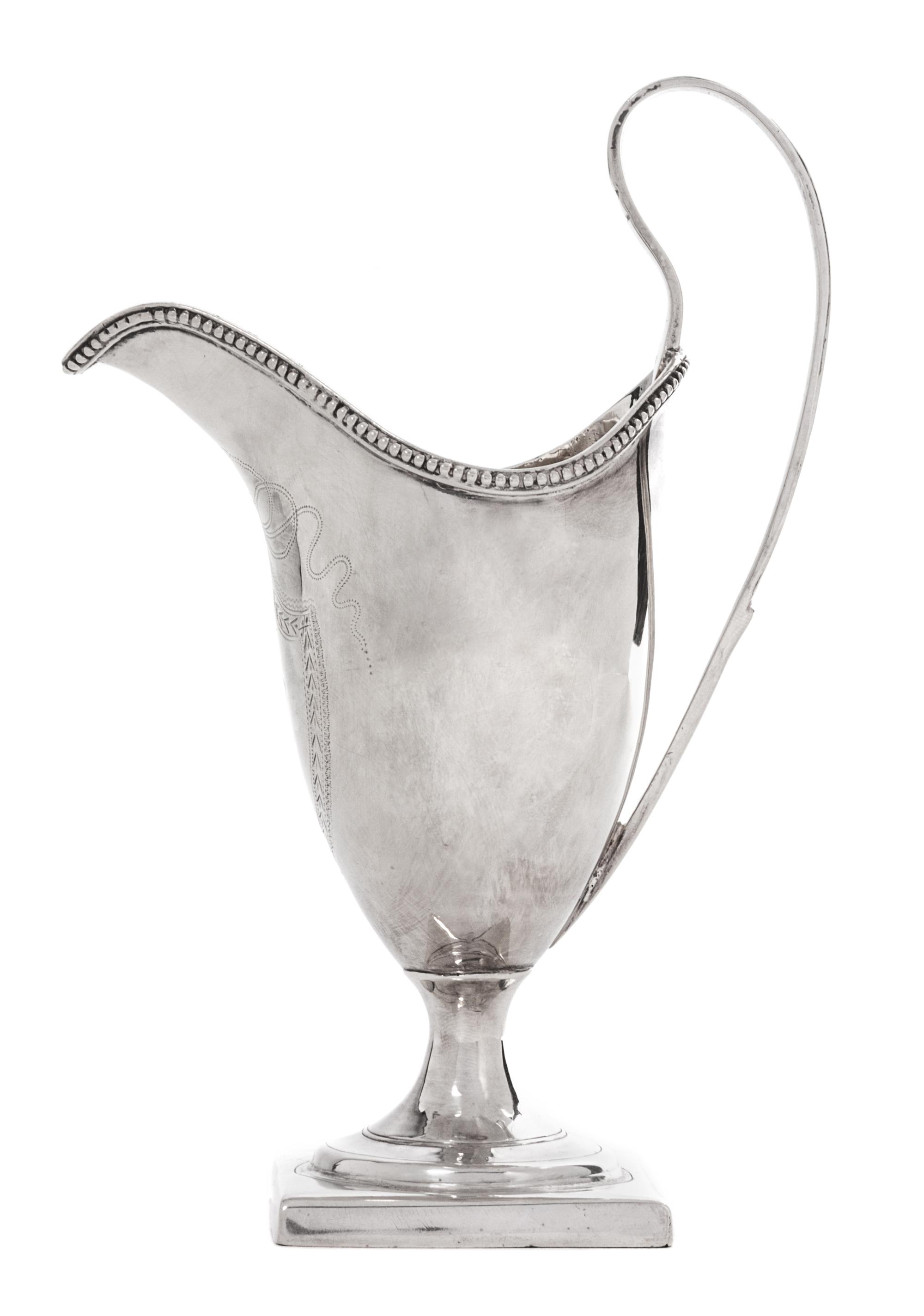 An English Silver Footed Creamer, George III, Late 18th/Early 19th Century, with beaded decoration along edge.