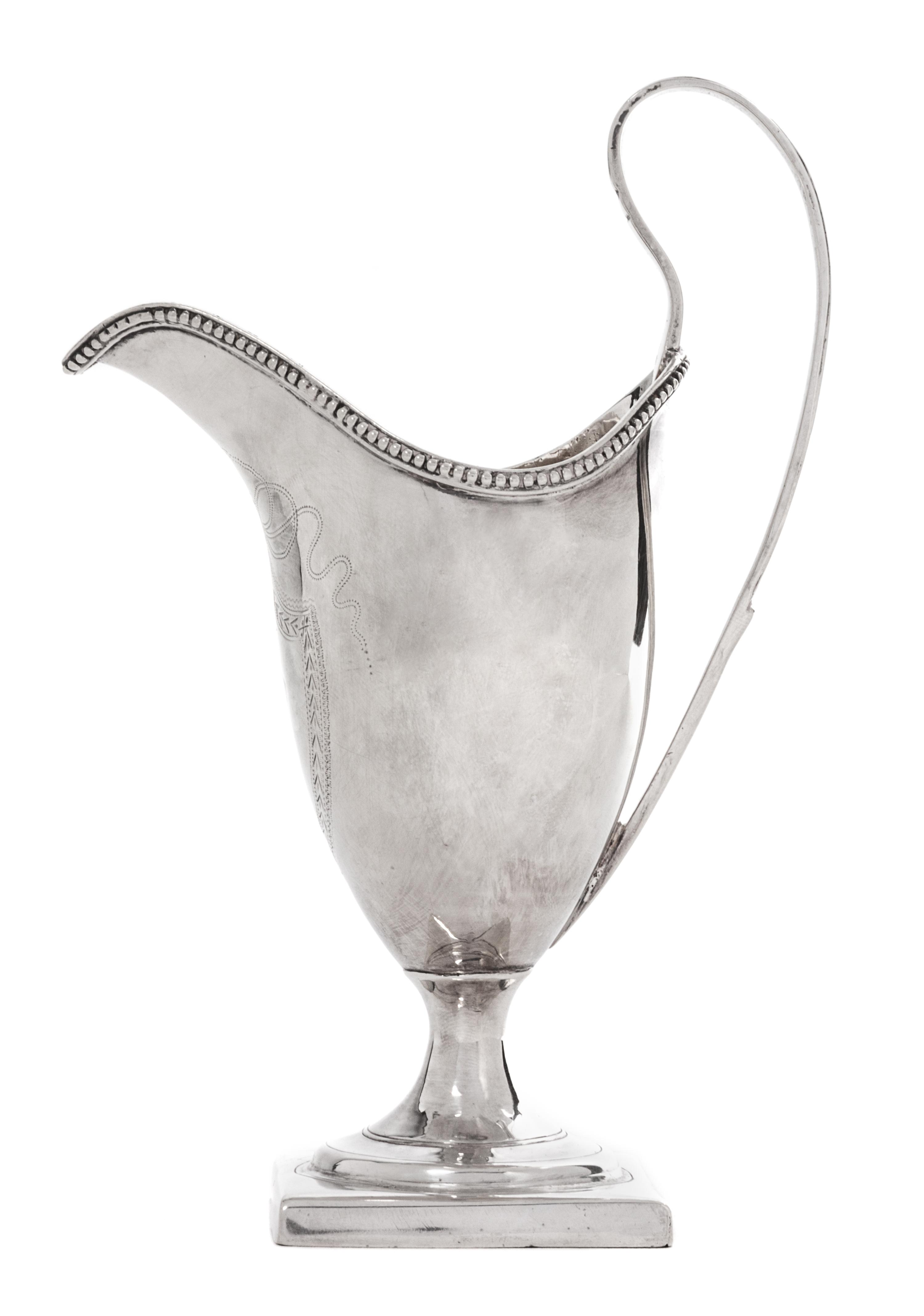 An English Silver Footed Creamer, George III, Late 18th/Early 19th Century, with beaded decoration along edge.
