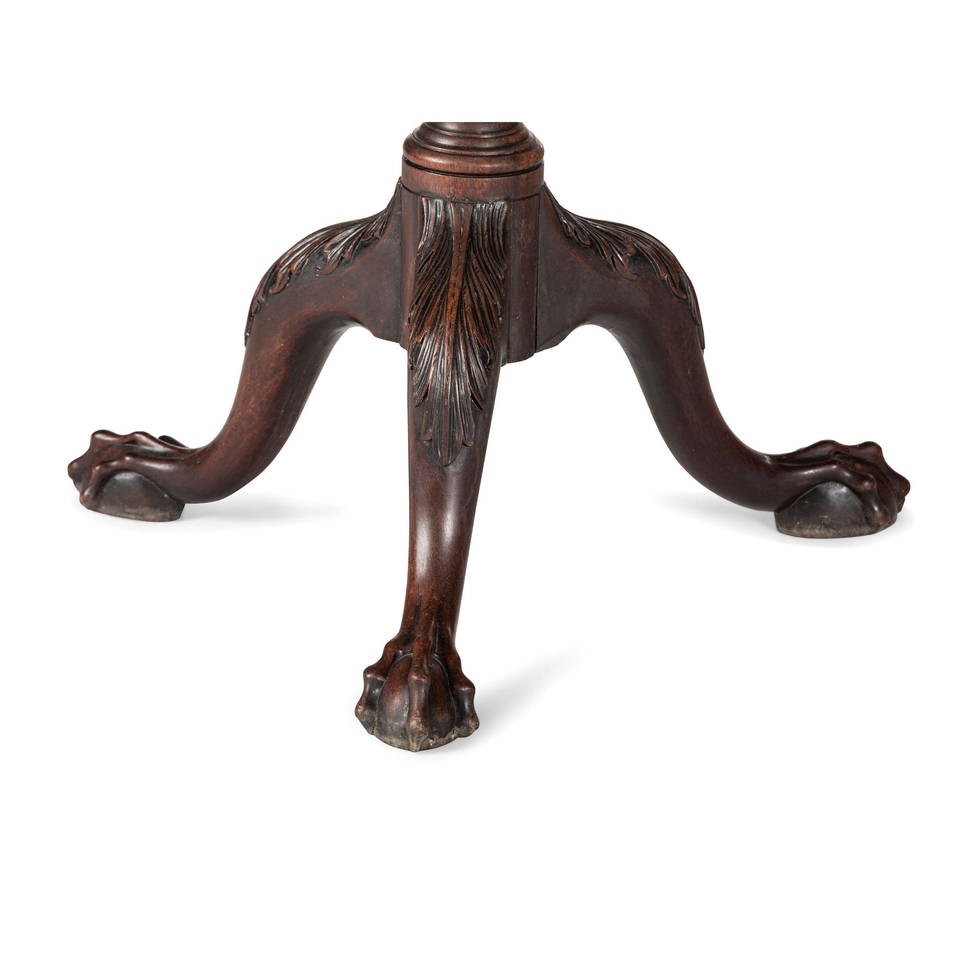 A Chippendale Carved and Figured Mahogany Pie-Crust Tilt-Top Tea Table