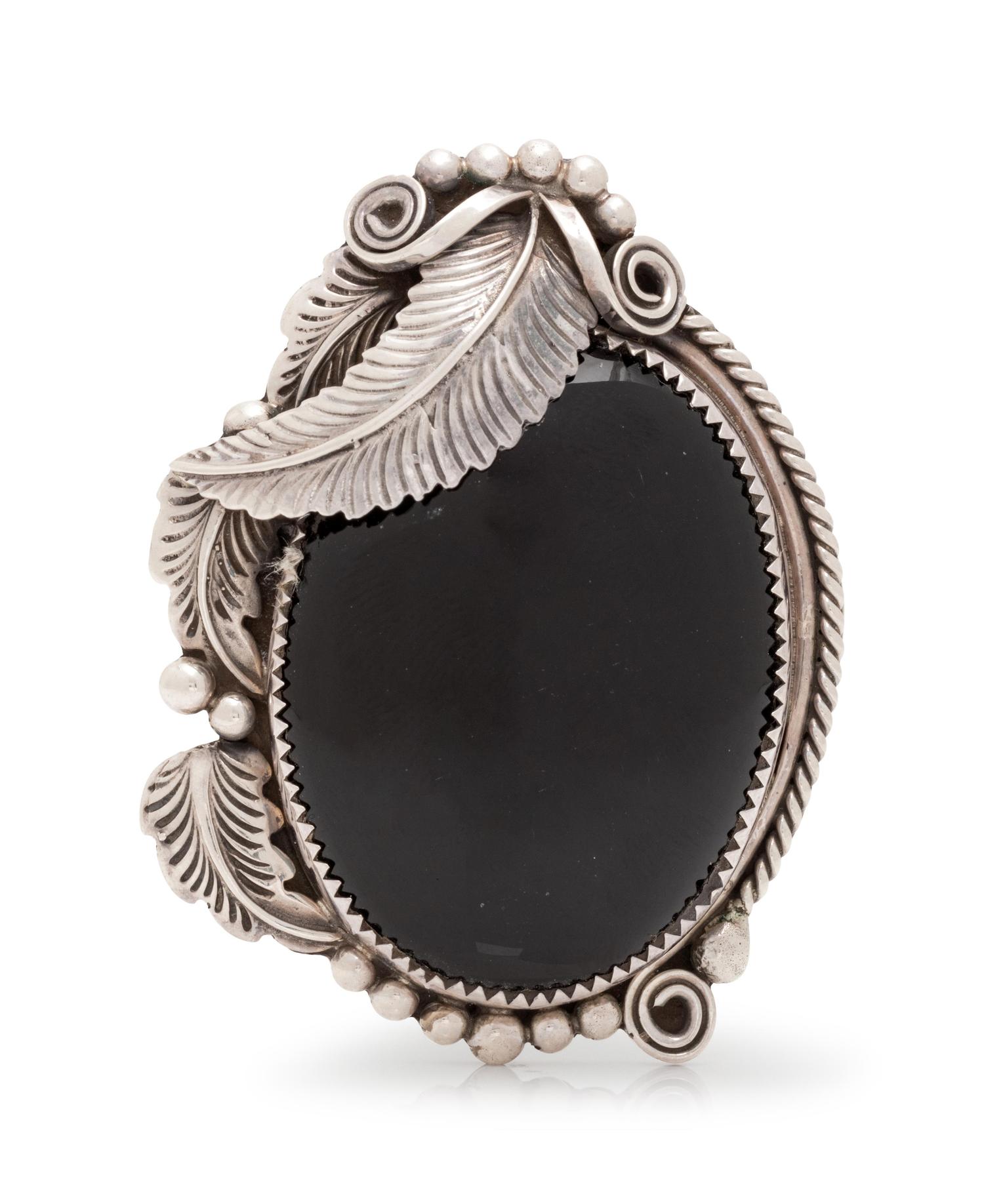 A Sterling Silver and Onyx Pendant/Brooch,