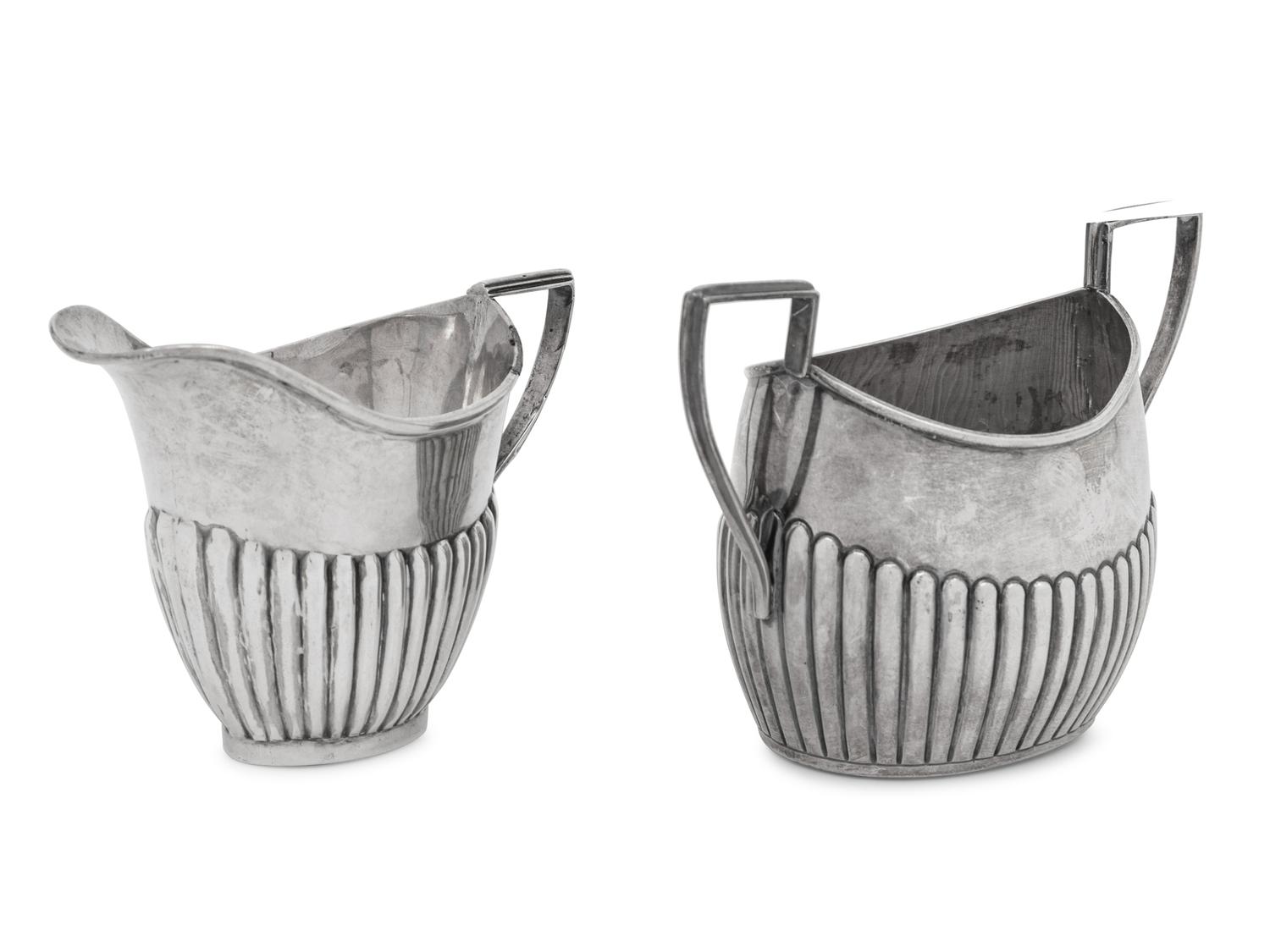 An Assembled Edwardian Silver Three-Piece Bachelor's Tea Service