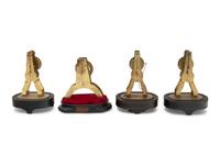 A Group of Four Brass Skeleton Clocks