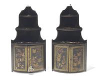 A pair of diminutive Regency style japanned hanging corner cupboards, 19th century