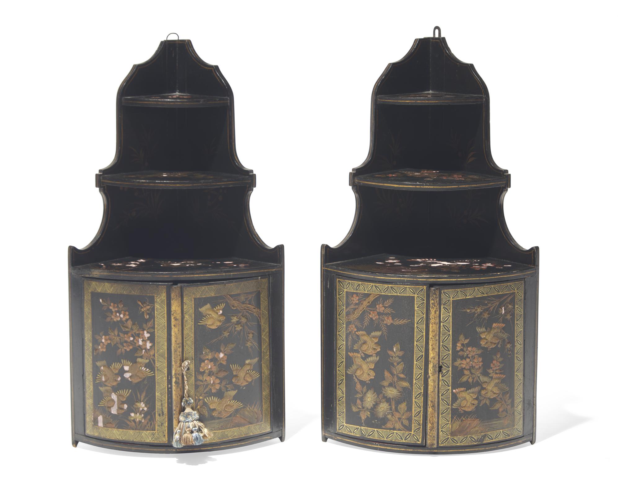 A pair of diminutive Regency style japanned hanging corner cupboards, 19th century
