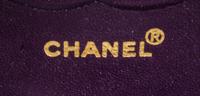 A Chanel Purple Suede Chevron Flap Handbag, 10" x 6.5" x 2.5".