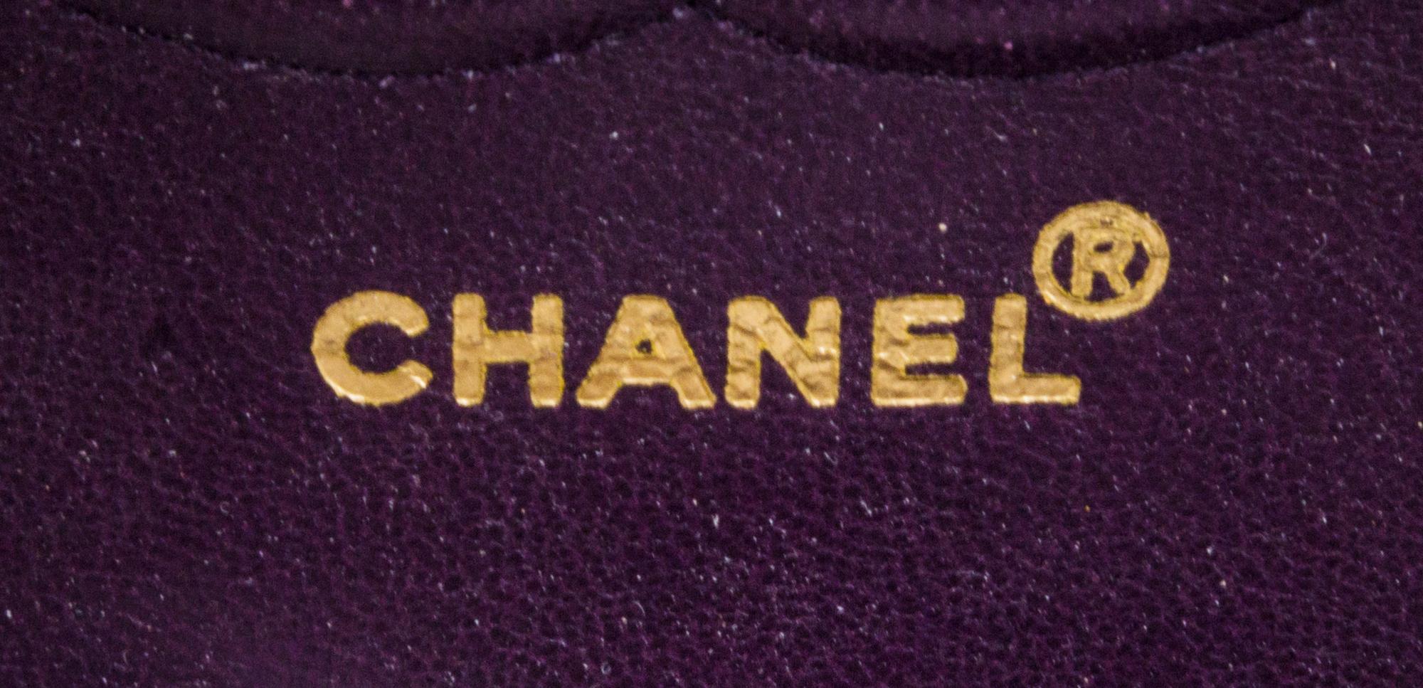 A Chanel Purple Suede Chevron Flap Handbag, 10" x 6.5" x 2.5".
