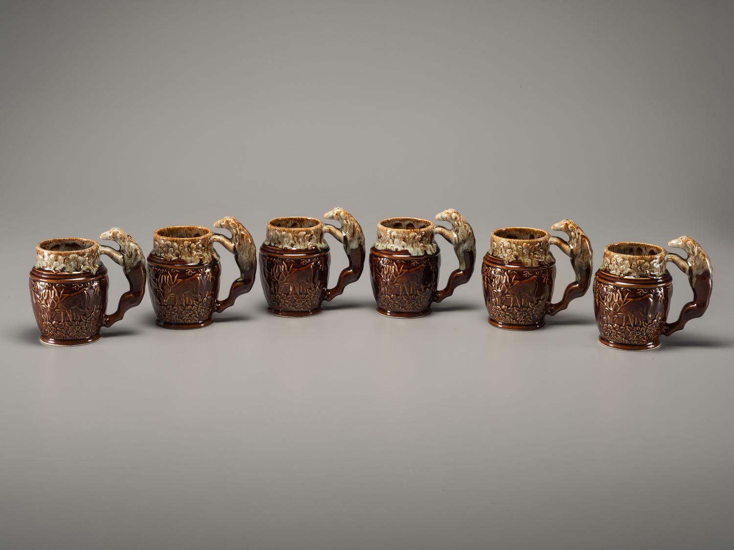 Fifteen Rockingham Glaze Mugs and Pig Banks