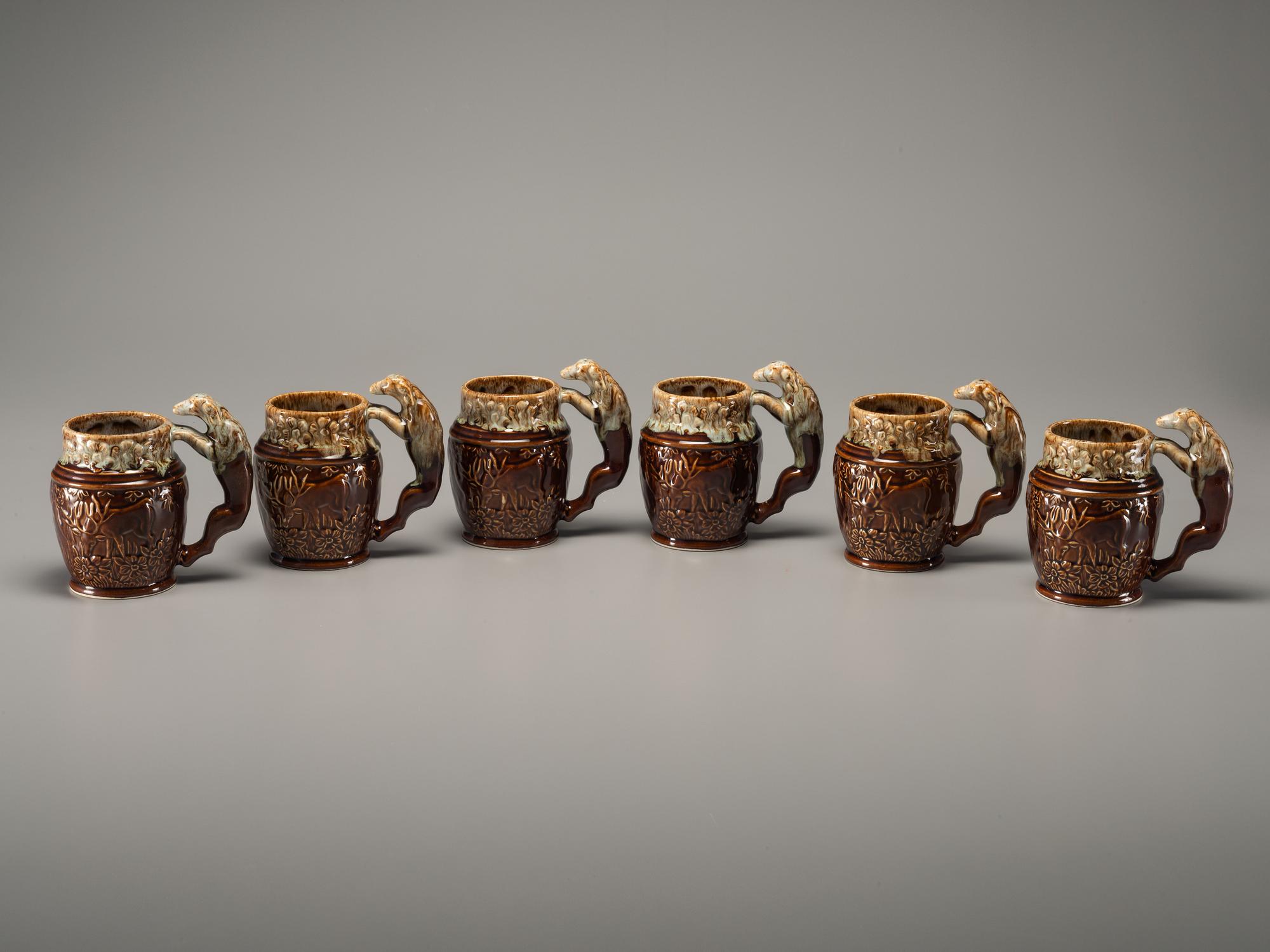 Fifteen Rockingham Glaze Mugs and Pig Banks