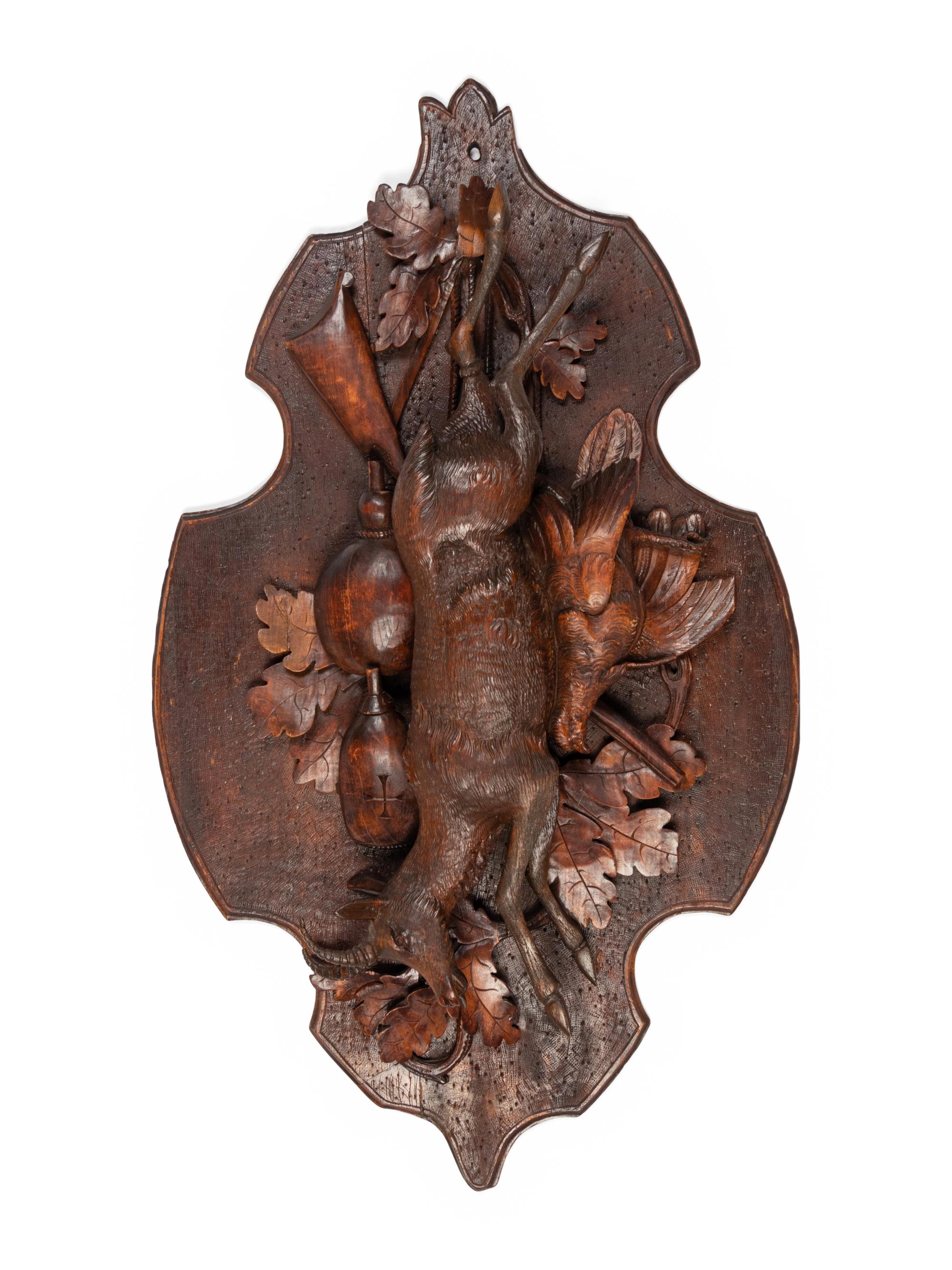 A Pair of Large Black Forest Carved Walnut Game Plaques