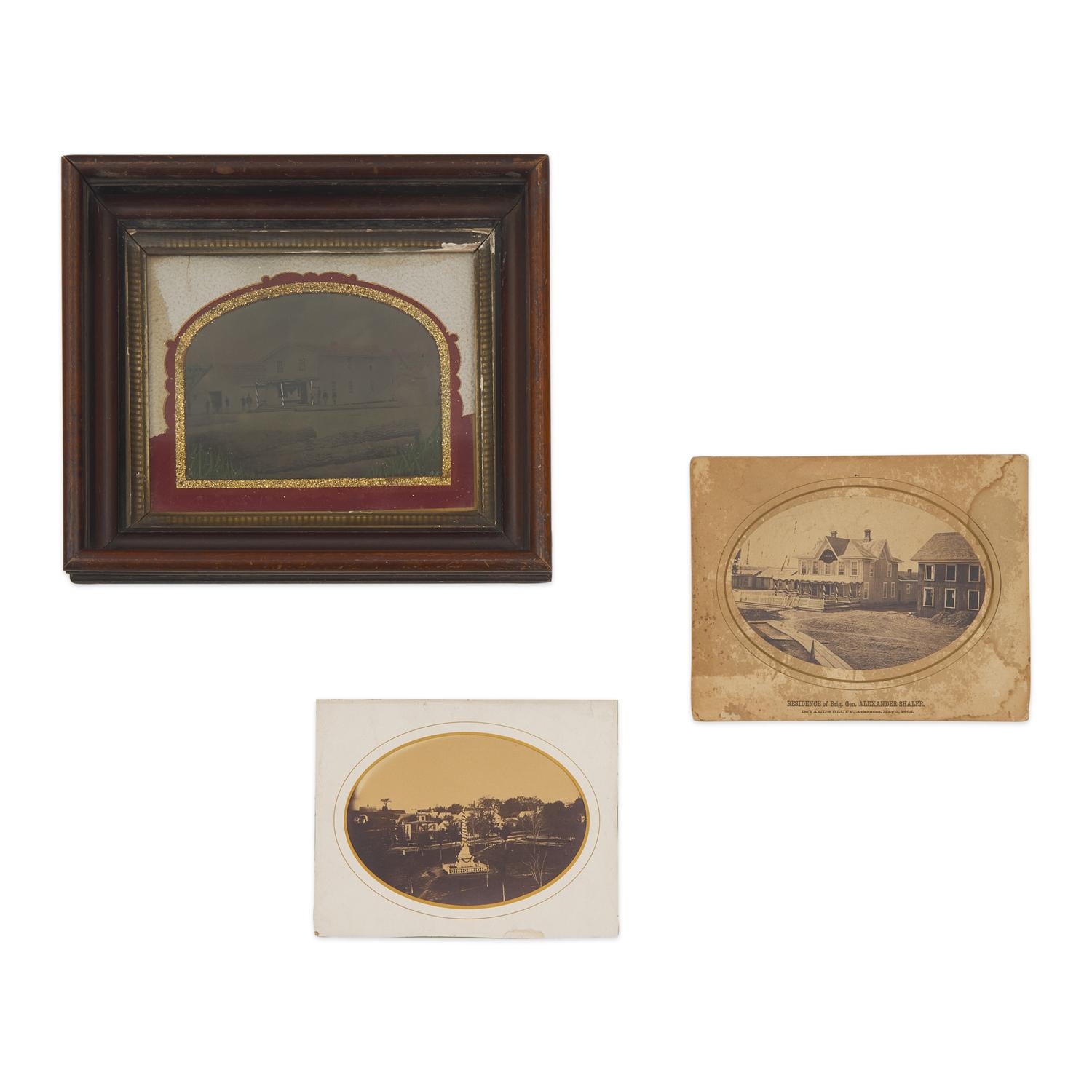 [Lincoln, Abraham]. A group of 3 photographs showing buildings and monuments draped in mourning.