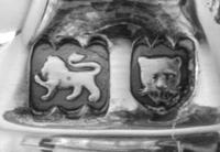 A Pair of George V Silver Five-Light Candelabra, Lionel Alfred Crichton, London, 1931, each having a central urn form candle cup issuin
