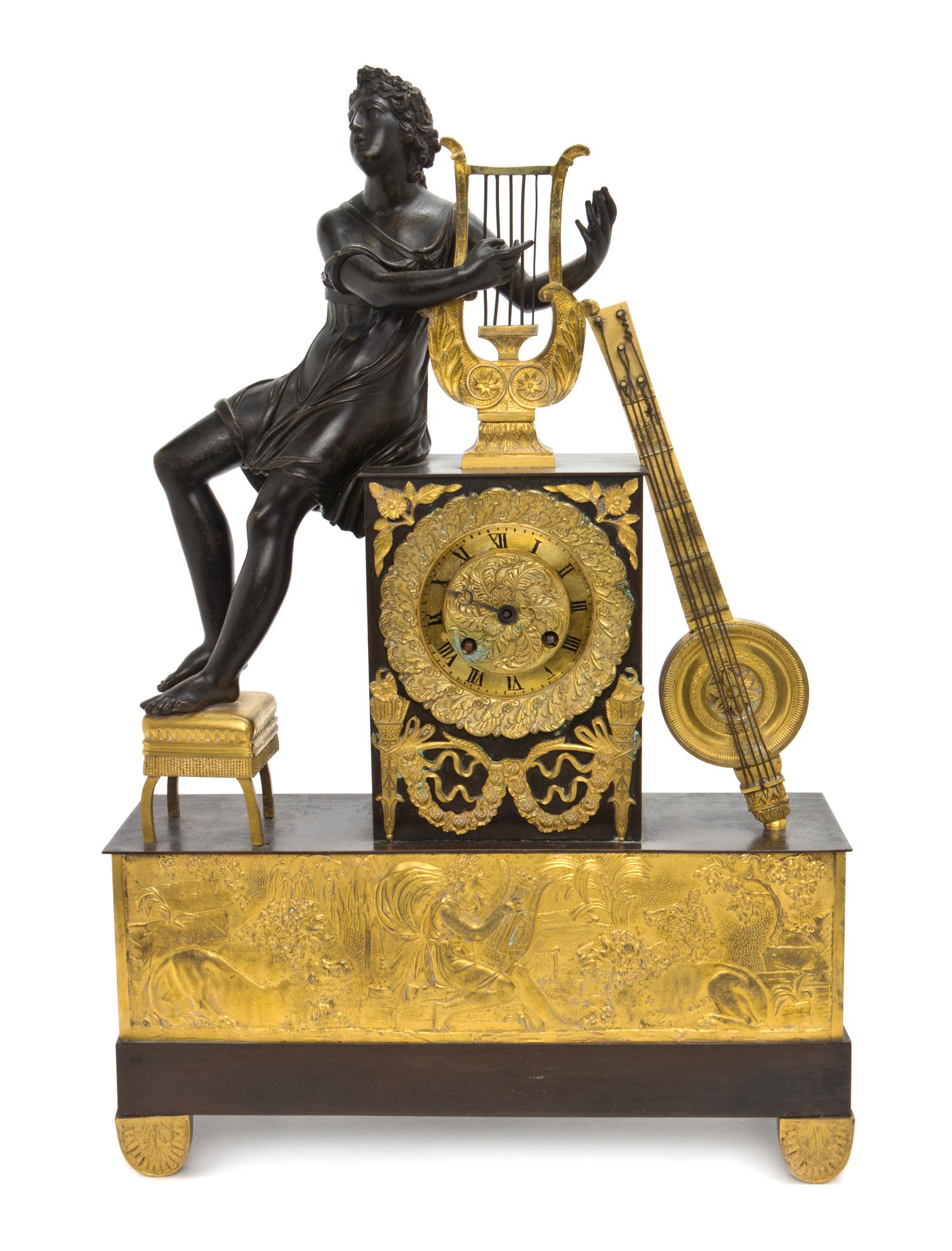 An Empire Parcel Gilt and Patinated Bronze Mantel Clock, Height 20 1/2 inches.