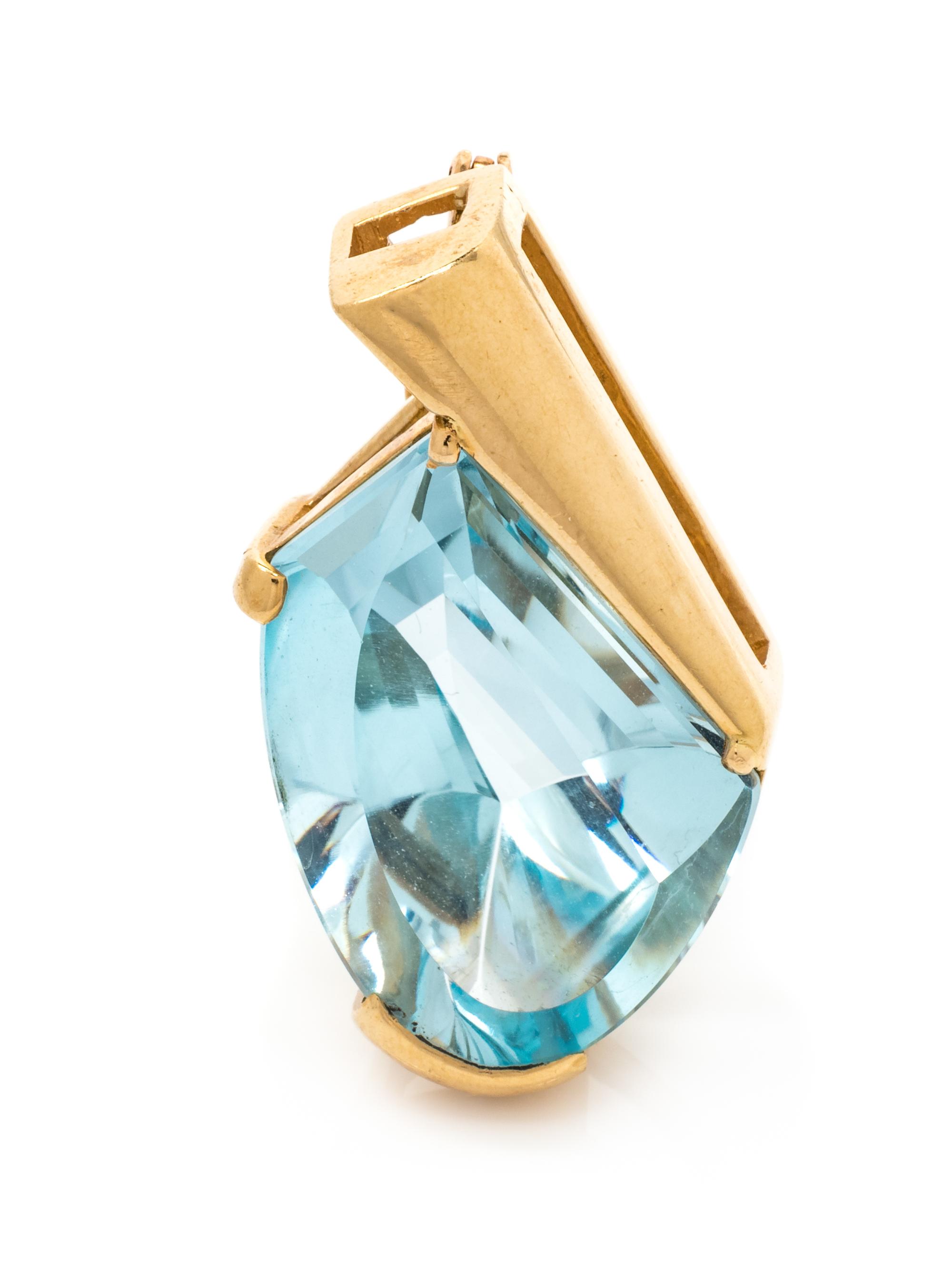 A 14 Karat Yellow Gold and Blue Topaz Pendant,