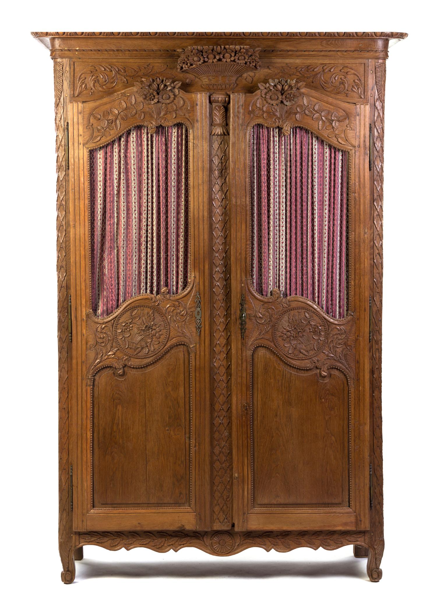 A French Provincial Oak Armoire, Height 87 x width 57 x depth 18 inches.