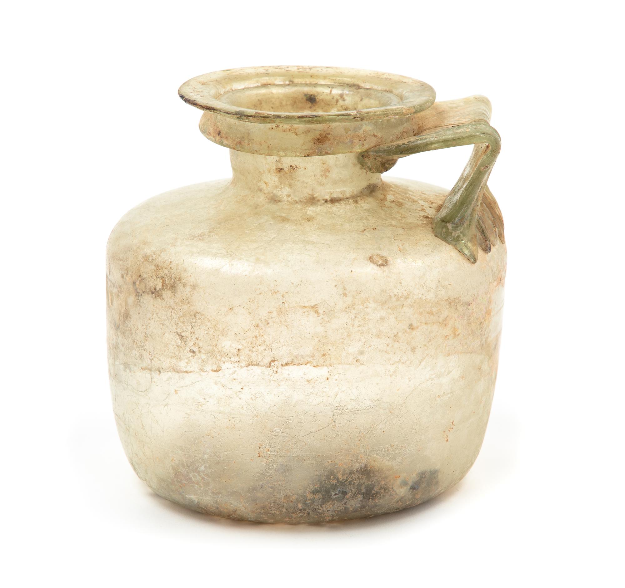 A Roman Glass Jug Height 5 1/4 inches. — CIRCA 1ST CENTURY C.E.