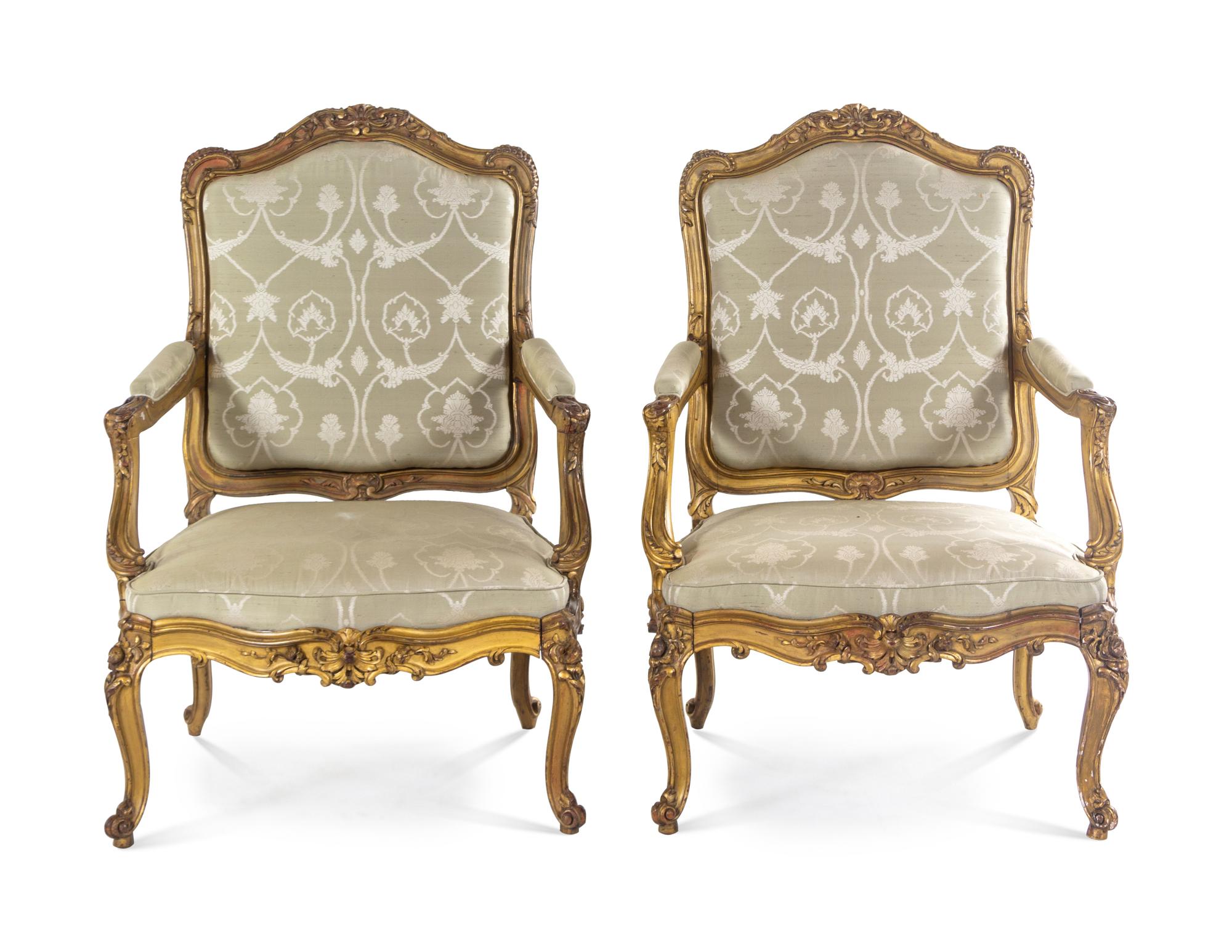 A Pair of Louis XV Giltwood Fauteuils a la Reine