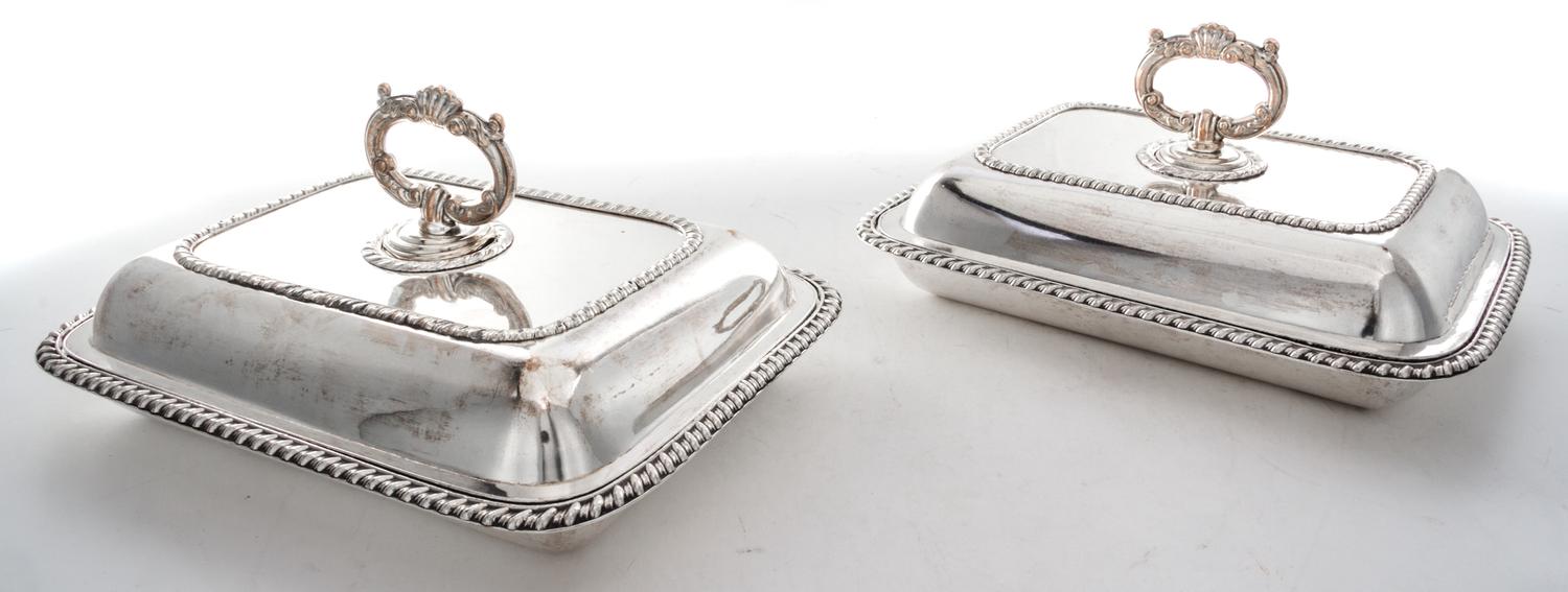 A Pair of Sheffield-plate Entree Dishes and Covers, Early 19th Century, of rounded rectangular form with gadrooned borders.