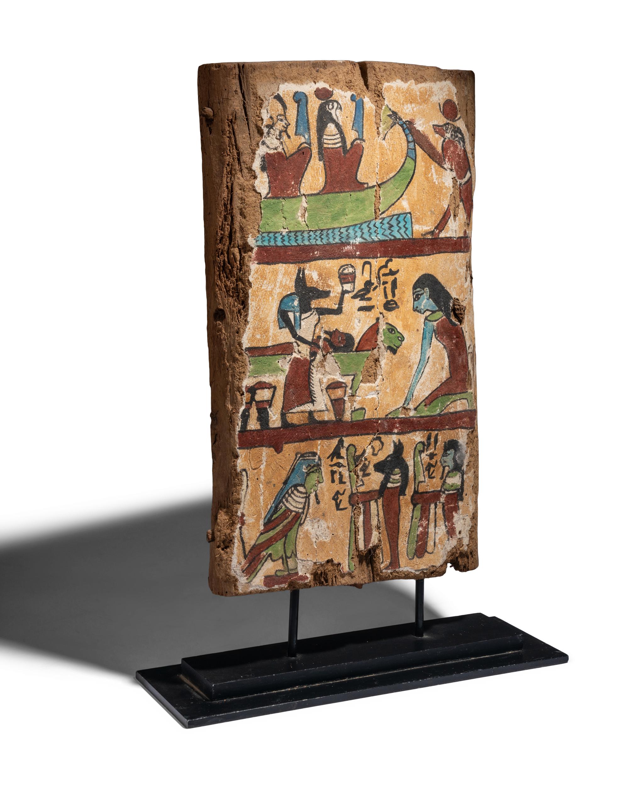An Egyptian Painted Wood Sarcophagus Fragment with a Boat Scene