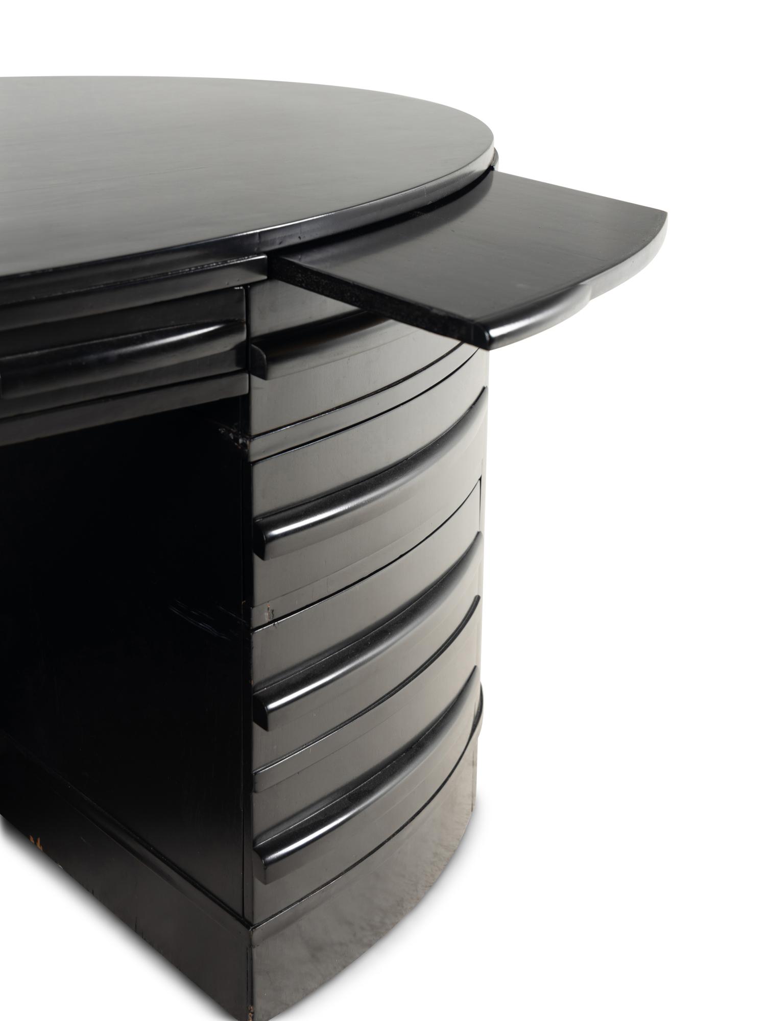 An Ebonized Oval Desk