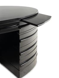 An Ebonized Oval Desk