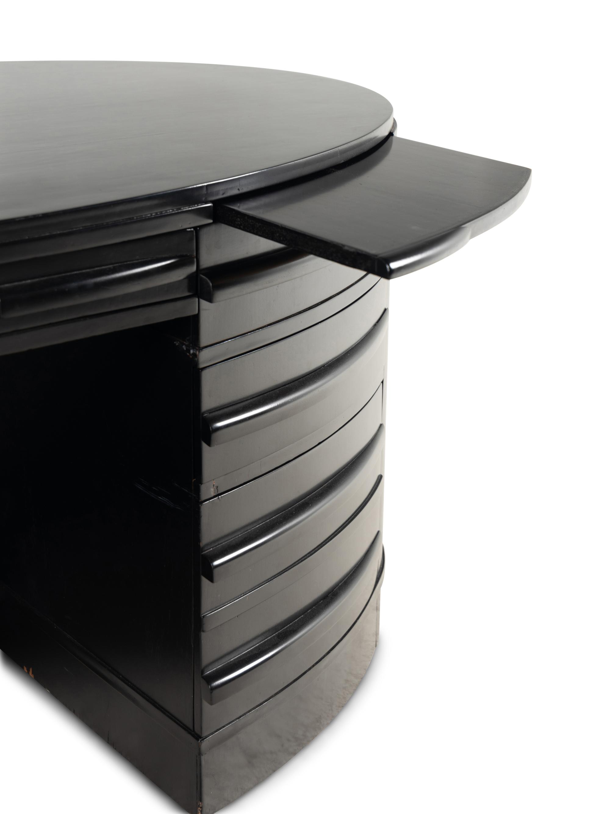 An Ebonized Oval Desk