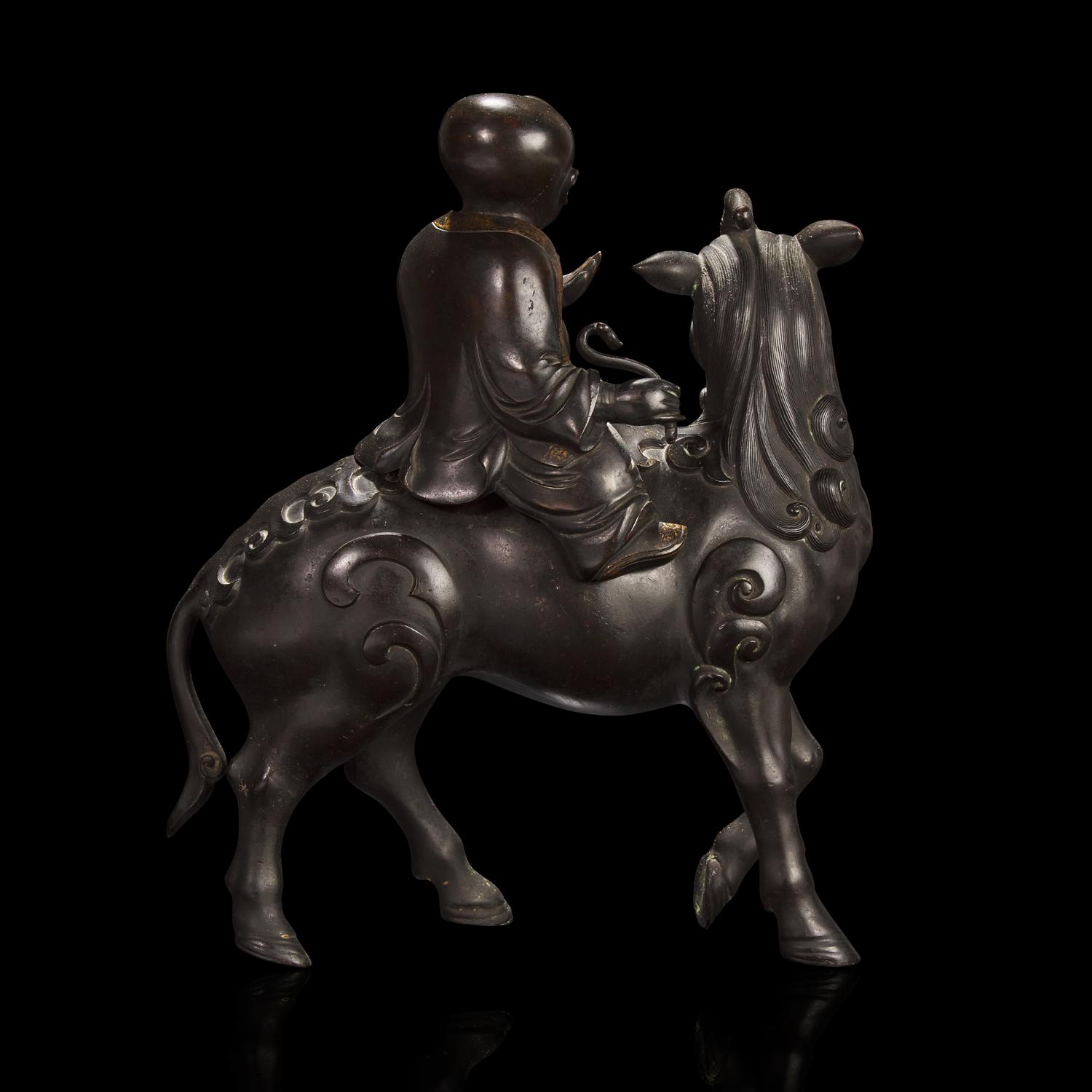 A Chinese Patinated and Parcel-gilt Bronze 'Qilin and Boy' Censer, 17th/18th Century 清早期 銅局部鎏金麒麟童子香薰