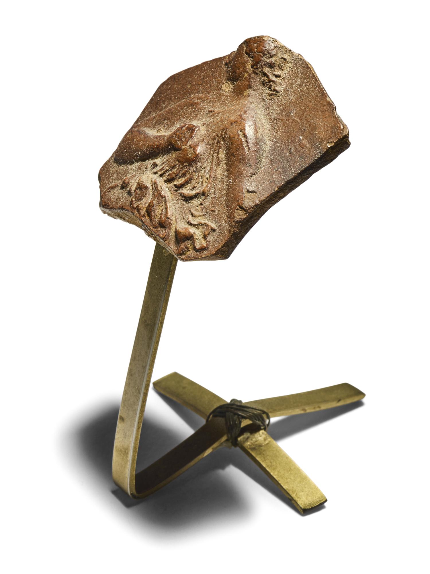 A Hellenistic Red-Ware Fragment with a Robed Woman
