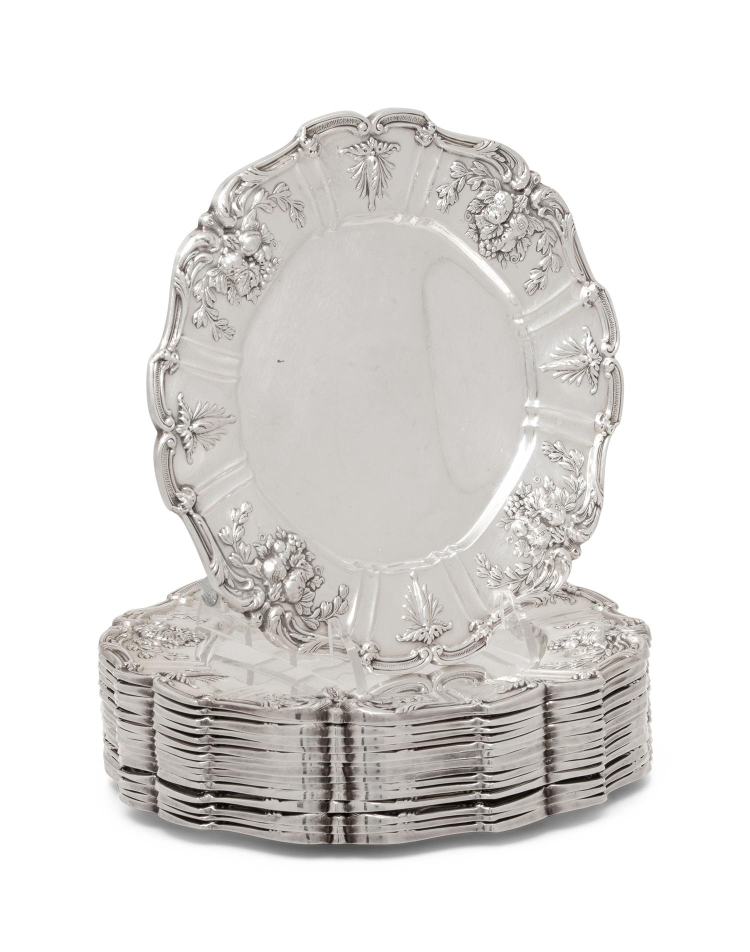 A Set of Sixteen American Silver Bread Plates