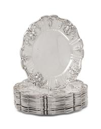 A Set of Sixteen American Silver Bread Plates
